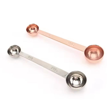 Professional double-sided stainless steel coffee scoop with 5mL and 15mL ends for accurate dosing.